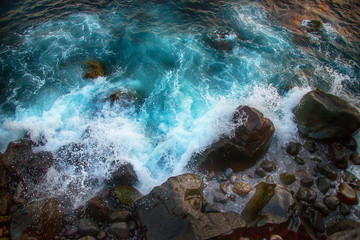 Blue raging waves crashing on the rocks in tne Atlantic ocean
