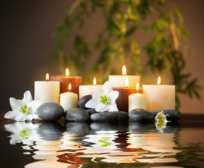 Beautiful spa composition with reflection on water surface