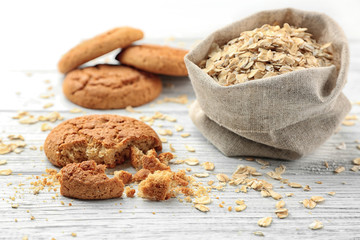 Diet cookies with oatmeal on white wooden background