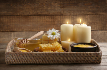 Body scrub and honey on wooden background
