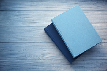 Books on grey wooden table