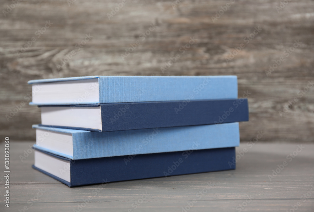 Sticker Books stacked on wooden background