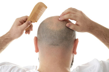 Bald adult man with comb on white background