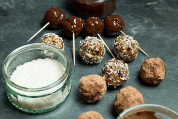 Various Protein Energy Balls and Dessicated Coconut in Bowl