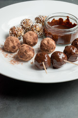 Assorted Protein Energy Balls and Melted Chocolate Dip on Plate
