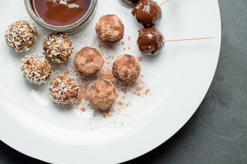Energy Balls and Melted Chocolate Dip on Plate