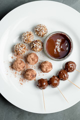 Protein Energy Balls and Melted Chocolate Dip on Plate