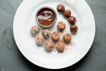 Overhead of Energy Balls and Chocolate Dip on Plate