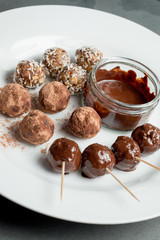 Energy Balls and Chocolate Dip on White Plate