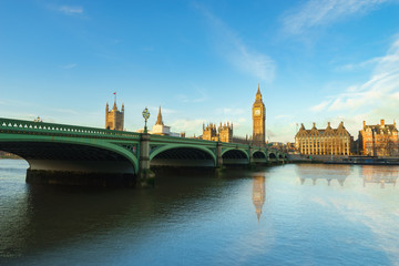 Fototapeta na wymiar Big Ben and Westminster parliament with blue sky and water reflection in London, UK