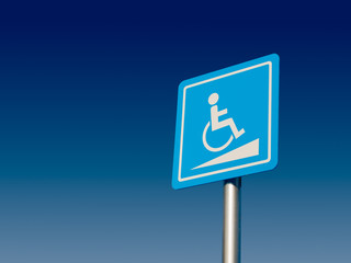 Disabled parking space and wheelchair way sign and symbols on a pole warning motorists