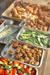 Grilled vegetables and meat on table