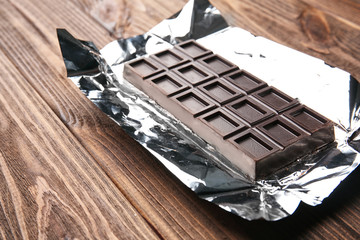 Chocolate bar on foil, closeup