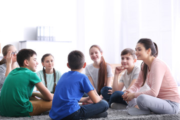 Female teacher conducting lesson at school