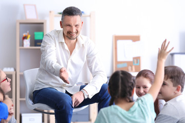 Male teacher conducting lesson at school