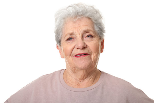 Portrait of smiling elderly woman on white background