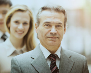 Happy smiling business team standing in a row