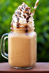 Chocolate frappe coffee with whipped cream outside