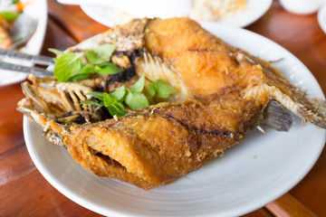 Deep fried snapper topped with sweet fish sauce with herbs