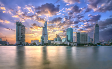Ho Chi Minh City, Vietnam - February 14th, 2017: Beauty skyscrapers along river light smooth down urban development in Ho Chi Minh City, Vietnam