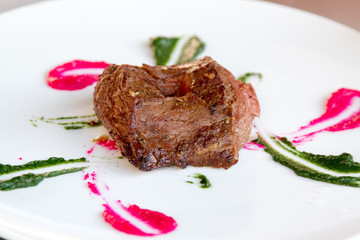 grilled red beef meat roll with sauce