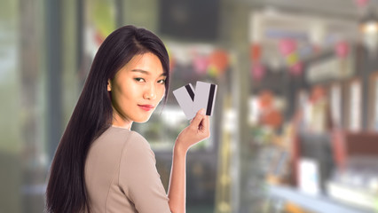 soft focus women holding shopping bags in her hand with blurred background