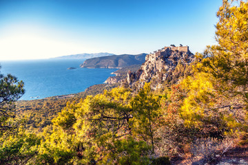 Fototapeta na wymiar Ancient Monolithos castle on cliff on Rhodes island, Greece - beautiful panorama view