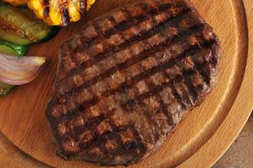 grilled beef steak, grilled vegetables - zucchini, corn, onion
