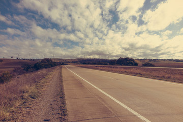Wind farm horizon road empty filter copyspace.