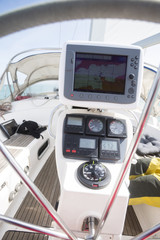 GPS Navigator At Helm Of Yacht