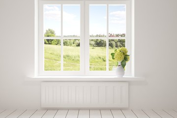 Fototapeta na wymiar White empty room with green landscape in window. Scandinavian interior design