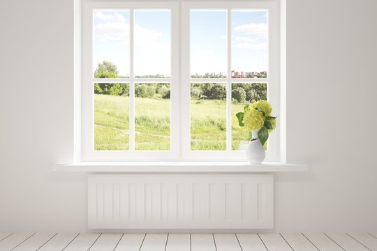 White empty room with green landscape in window. Scandinavian interior design