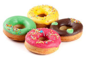 four glazed donuts isolated on white background