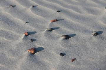Sandy surface with small stones.