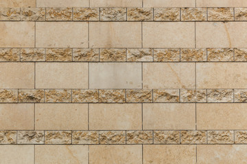 Antic tile. The close up of the wall with vintage beige tile.