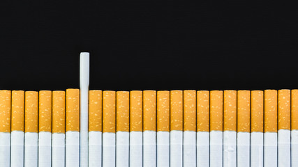 Cigarettes, tobacco, close-up on a black background.