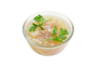 Pork jelly in the glass bowl on a light background