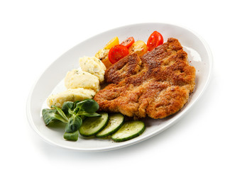 Fried pork chop, puree and vegetables 