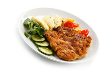 Fried pork chop, puree and vegetables 