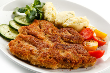 Fried pork chop, puree and vegetables 