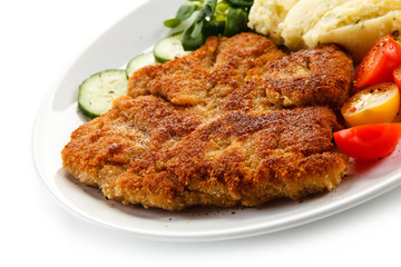 Fried pork chop, puree and vegetables 