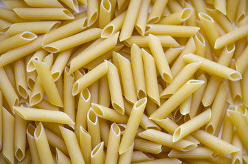 Pasta background, texture, close-up Italian Penne, high resolution picture