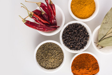 Spices in Bowl on white background