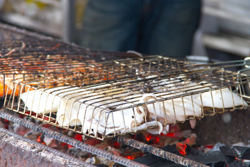 fresh squid barbeque grilled on charcoal stove