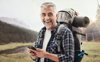 Hiker using a smartphone