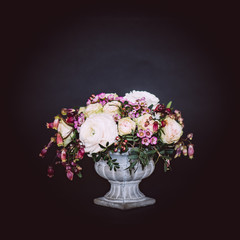Vintage flower bouquet in old style vase