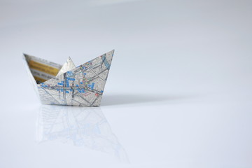 right course, paper boat, road map on board, open infinite space, freedom navigation