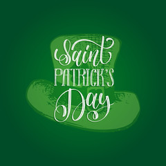 Vector Saint Patrick's Day hand lettering greetings card or poster design. Sketched leprechaun hat on green background.