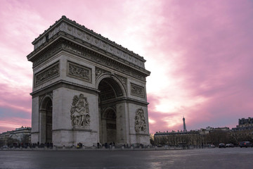 Fototapeta na wymiar Arch of Triumph in Paris with purple sunset in background