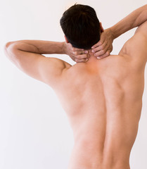 Obraz premium Fit healthy man holds his neck in pain